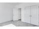 Clean bedroom with neutral carpeting and closet with double doors, promoting calm and order at 804 Heathered Farm Way, Apex, NC 27523