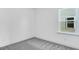 Bright bedroom featuring gray carpet and a window for natural light at 804 Heathered Farm Way, Apex, NC 27523