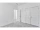 Clean bedroom with gray carpet and a closet with double doors at 804 Heathered Farm Way, Apex, NC 27523