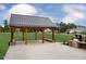 Open air building with stainless steel grill and seating area for community members at 804 Heathered Farm Way, Apex, NC 27523