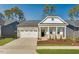 Charming single Gathering home, well-manicured lawn, and a two-car garage at 804 Heathered Farm Way, Apex, NC 27523