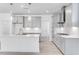 Stylish kitchen with gray cabinets, stainless steel appliances, and a sleek backsplash at 804 Heathered Farm Way, Apex, NC 27523