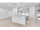 Modern kitchen featuring white cabinets, stainless steel appliances, and an island at 804 Heathered Farm Way, Apex, NC 27523
