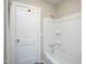 Clean bathroom featuring a white tub with shower and neutral wall color at 925 Redgate Ave, Rocky Mount, NC 27801