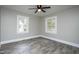 Bedroom showcasing wood-look floors and windows at 925 Redgate Ave, Rocky Mount, NC 27801