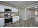 Kitchen featuring white cabinets, stainless steel appliances, and hardwood countertops at 925 Redgate Ave, Rocky Mount, NC 27801