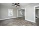 Bright living room featuring wood-look floors, freshly painted walls, and ample natural light at 925 Redgate Ave, Rocky Mount, NC 27801