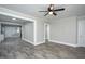 Open-concept space with wood-look floors, freshly painted walls, and connecting rooms at 925 Redgate Ave, Rocky Mount, NC 27801