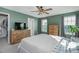 Bedroom with green walls, large dresser, and a walk-in closet at 104 Ridgeline Ct, Durham, NC 27703