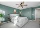 Bedroom with green walls, a queen bed, and a ceiling fan at 104 Ridgeline Ct, Durham, NC 27703