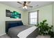 Bedroom with light green walls, a queen bed, and ceiling fan at 104 Ridgeline Ct, Durham, NC 27703