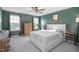 Spacious bedroom with green walls, large bed, and ample natural light at 104 Ridgeline Ct, Durham, NC 27703