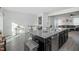 Open concept kitchen with island and view into living room at 104 Ridgeline Ct, Durham, NC 27703