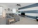 Spacious living room with L-shaped sectional sofa and accent wall at 104 Ridgeline Ct, Durham, NC 27703