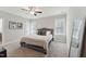 Bright bedroom with double bed, carpet, and ceiling fan at 107 York Dr, Oxford, NC 27565