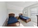 Bedroom with twin beds, nightstand, and window at 107 York Dr, Oxford, NC 27565