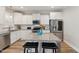 Modern kitchen with white cabinets, granite island, stainless steel appliances at 107 York Dr, Oxford, NC 27565