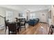 Living room features hardwood floors, dining table, and a blue sofa at 107 York Dr, Oxford, NC 27565