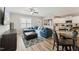 Open concept living area with a blue sectional sofa and kitchen at 107 York Dr, Oxford, NC 27565