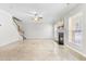 Gathering room with fireplace, ceiling fan and hardwood floors at 108 Minnifer Ct, Apex, NC 27539