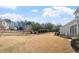 Spacious backyard with a grassy lawn and privacy fence at 1109 Timbercut Dr, Durham, NC 27703