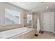 Spa-like bathroom featuring a large soaking tub and walk-in shower at 1109 Timbercut Dr, Durham, NC 27703