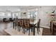 Bright dining area with hardwood floors and a large window at 1109 Timbercut Dr, Durham, NC 27703