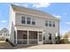 Gray two-story house with screened porch and backyard at 1109 Timbercut Dr, Durham, NC 27703