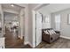 Bright hallway with hardwood floors and access to multiple rooms at 1109 Timbercut Dr, Durham, NC 27703