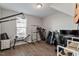 Well-equipped home gym featuring treadmill, weight bench, and ample floor space at 1109 Timbercut Dr, Durham, NC 27703