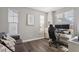 Bright home office with hardwood floors, large windows, and built-in workspace at 1109 Timbercut Dr, Durham, NC 27703