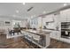 Spacious kitchen with granite countertops, white cabinets, and stainless steel appliances at 1109 Timbercut Dr, Durham, NC 27703