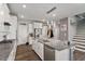 Open kitchen with island, granite countertops, stainless steel appliances, and pantry at 1109 Timbercut Dr, Durham, NC 27703