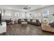 Spacious living room with a comfortable sectional sofa and hardwood floors at 1109 Timbercut Dr, Durham, NC 27703