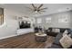 Gathering room with sectional sofa, hardwood floors, and built-in entertainment center at 1109 Timbercut Dr, Durham, NC 27703