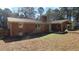 Brick home with large backyard and partial fence at 1202 Vandora Ave, Garner, NC 27529