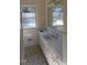 Bathroom with double vanity and checkered floor at 1202 Vandora Ave, Garner, NC 27529
