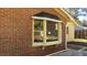 Brick home exterior featuring a bay window at 1202 Vandora Ave, Garner, NC 27529