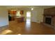 Open concept living room with hardwood floors and kitchen view at 1202 Vandora Ave, Garner, NC 27529