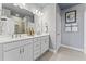 Elegant bathroom with double vanity and a shower at 1241 S Blount Street # 101, Raleigh, NC 27601