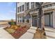 Brick front exterior of townhome with landscaping and walkway at 1241 S Blount Street # 101, Raleigh, NC 27601