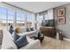 Light-filled living room with large windows and stylish furniture at 1241 S Blount Street # 101, Raleigh, NC 27601