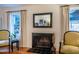 Fireplace with a mirror and artwork above the mantle at 13 Clover Dr, Chapel Hill, NC 27517