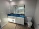 Bathroom with double vanity, granite countertop, and soaking tub at 16 Shiloh Dr, Lillington, NC 27546