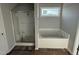 Bathroom featuring a shower and garden tub at 16 Shiloh Dr, Lillington, NC 27546