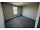 Spacious bedroom with grey carpet and a window at 16 Shiloh Dr, Lillington, NC 27546