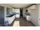 Modern kitchen featuring white cabinets and granite countertops at 16 Shiloh Dr, Lillington, NC 27546