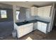 Modern kitchen with white cabinets and granite countertops at 16 Shiloh Dr, Lillington, NC 27546
