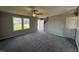 Spacious living room with gray carpeting and neutral walls at 16 Shiloh Dr, Lillington, NC 27546