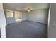 Spacious living room with gray carpet and neutral walls at 16 Shiloh Dr, Lillington, NC 27546